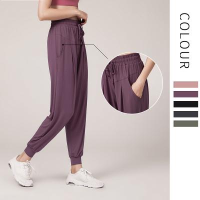 China Breathable thin quick-drying loose link feet run fitness motion pocket solid color high waist casual yoga pants for sale