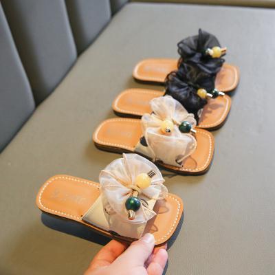 China All-match flat slippers girl's fashion bow sandals summer vacation beach shoes outdoor slippers girls flat non-slip slippers for sale