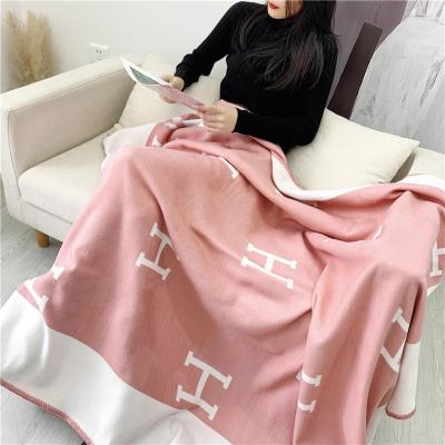 China New H cashmere letter wool shawl flying cushion cover 135*165cm sofa large thick air conditioning cashmere cover for sale