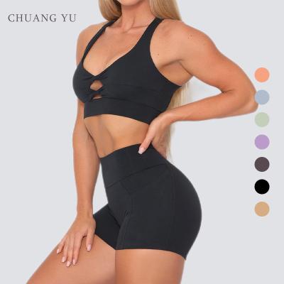 China Breathable Custom Logo Exercise Workout Biker Yoga Gym Wear Set Clothes Twist Front Sports Bra And Compression Women Shorts 2 Pieces for sale