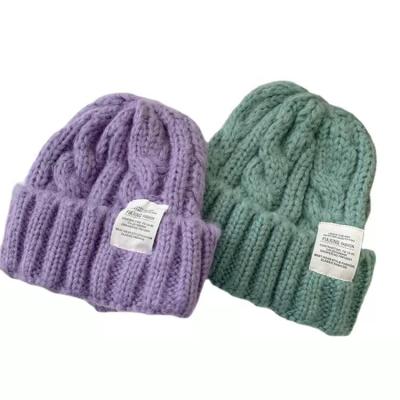 China JOINT Wild And Loose In Ear Protection Knitted Wool Hat 2022 Winter for sale