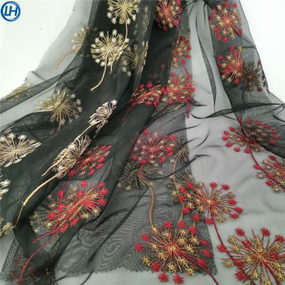 China Breathable hot high quality shiny floral eyelace embroidery hand sale eyelet net embroidery design fabric for wedding dress for sale