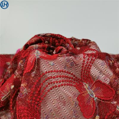 China Breathable hot high quality shiny floral eyelace embroidery hand sale eyelet net embroidery design fabric for wedding dress for sale