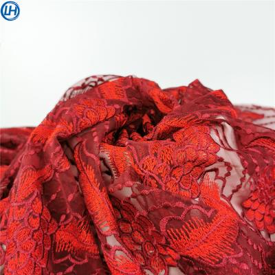 China Breathable hot high quality shiny floral eyelace embroidery hand sale eyelet net embroidery design fabric for wedding dress for sale