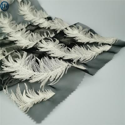 China Hot sale breathable high quality eyelet decoration eyelet feather design organza dress women organza based embroidery fabric for sale