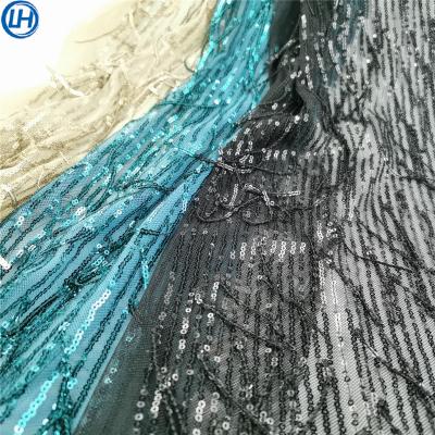 China High quanlity dress decoration 3D tassel design shine breathable breathable beads netting based around the edges sequins embroidery fabric for sale