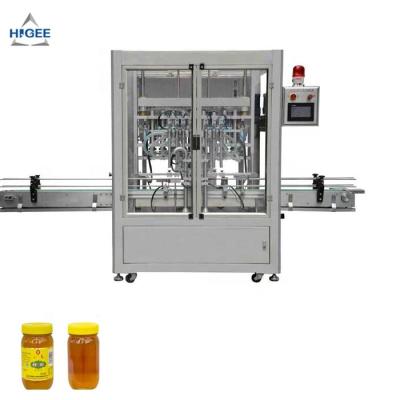 China Food honey bottling machine with jam filling capping machine with glass bottles glass jar cream filling machine for sale