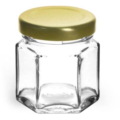 China Food 45ml 1.5oz 4 oz 6 oz 9 oz 12 oz 16 oz Clear Glass Jars Clear Hexagon Glass Jars With Black Metal Hook Caps for sale