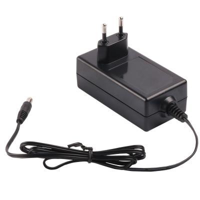 China Hot Selling High Quality AC100-240V Input 50-60hz DC12V 2A 12v 2a DC AC Adapter Power Supply 100*70*49 (mm) for sale