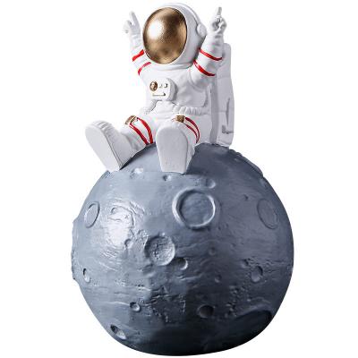 China Children's Creative Money Storage Box Astronaut Coin Bank The New Kids Favorite Astronaut Piggy Bank Desktop Money Saving Box Supply for sale