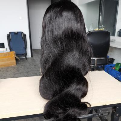 China Can be straightened and virgin wig the body wave curly 13x4 lace frontal transparent lace hair wig free shipping for sale