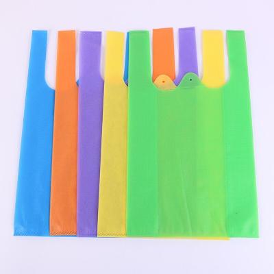 China Hot Selling High Quality Recyclable Customized Eco Friendly Promotional Non Woven Fabric W Cut Shopping T Shirt Bag Size S 45x25+12cm for sale