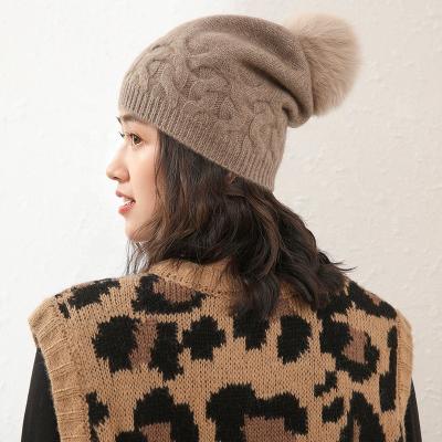 China High Fashion Winter Warmers Cashmere COMMON Cable Knitted Fox Fur Hat 100% Cashmere Beanie Hat With Pom Pom for sale