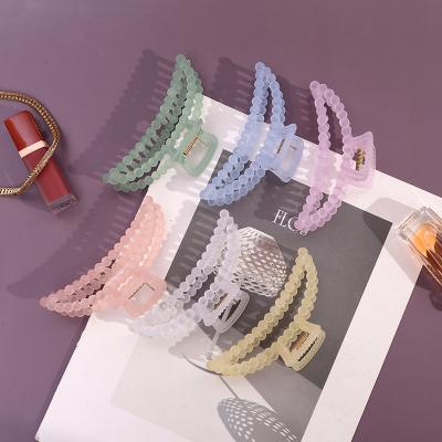 China Newest 2021 New Moon Hair Claw Candy Color Round Pearl Claw Clip Jelly Color Frosted Hair Claw Hair Accessories for sale