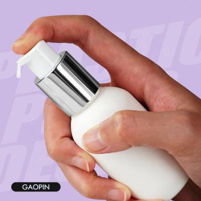 China Non Spill Shiny Liner 20/410 Sliver Treatment Pump Skin Care Cream Lotion Plastic Pump Head for sale