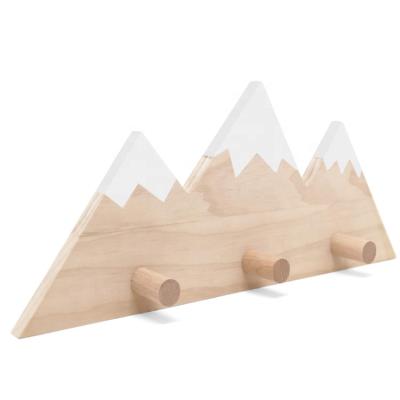 China Sustainable Minimalist Decorative Exquisite Mountain Wall Coat Hooks Polynesian Wood Hook for sale