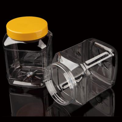 China Storage Jars 1800ml Plastic Square Candy Clear Jars With Handle Lids PET Containers for sale