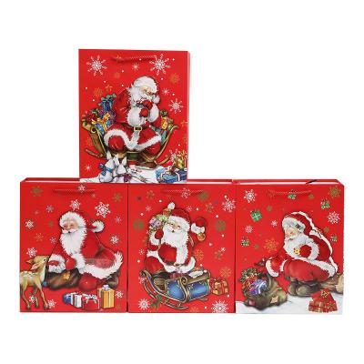 China Recycled Custom Paper Bag Christmas Shopping Gift Materials Christmas Shopping Gift Paper Cardboard Bag Santa Claus Printing White Retail Packaging Custom Paper Bag for sale