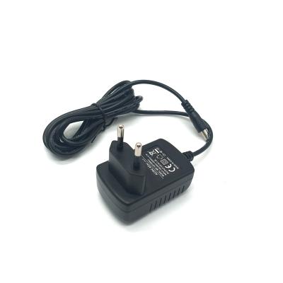 China CE FCC RoHs SAA Certificated Au Eu Us UK 5v 1a 5v 2a 5v 3a Plug Black Wall Power Adapter 62.3*40*27mm for sale