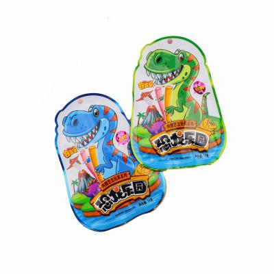 China Natural Fruity Flavors CC Stick Candy With Mini Dinosaur Surprise Candy Toy For Kids for sale