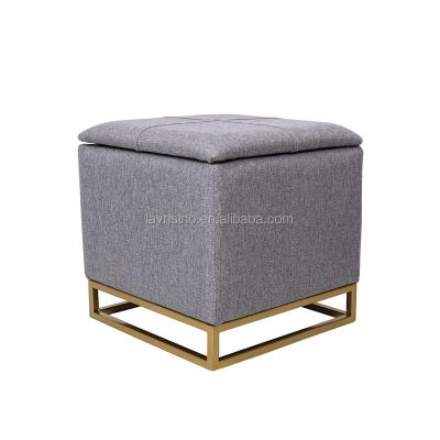 China Luxury Gray Fabric Storage Square Footstool Storage Home Furniture Bedroom Gold Metal Legs Ottoman for sale