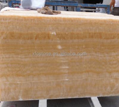 China Modern Cheap Price Chinese Honey Yellow Onyx Stone Translute Slab And Tiles for sale