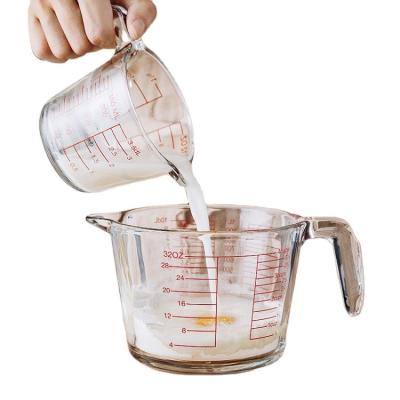 China Multi Viable Kitchen Tools Size Transparent Milk&flour Measuring Cup Glass Mug With Glass Handle And Red Scale for sale