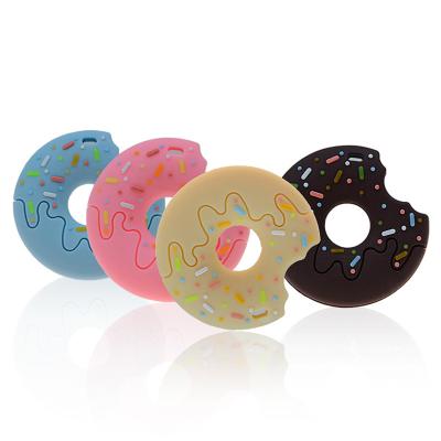 China Custom Made Eco-Friendly BPA Free Newborn Nursing Teether Toys Silicone Donut Shape Funny Baby Teether for sale