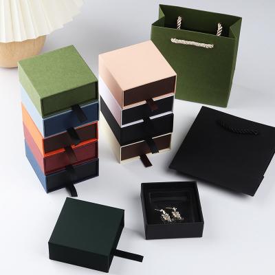 China Durable Exquisite Plush Hard Explosion Box Material Drawer Surprise Jewelry Gift Wrapping Paper Sliding Packaging Box Fashionable Box for sale