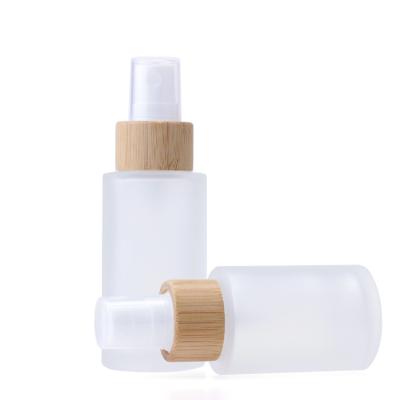 China Wholesale Personal Care 30ml 40ml 60ml 80ml 100ml Eco-friendly Bamboo Cosmetic Sprayer Frosted Clear Cylinder Glass Spray Bottle For Skin Care for sale