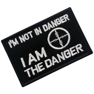 China Handmade Tactical Black and White I'm Not In Danger Embroidered Sew On Hook And Loop Patch Badge for sale