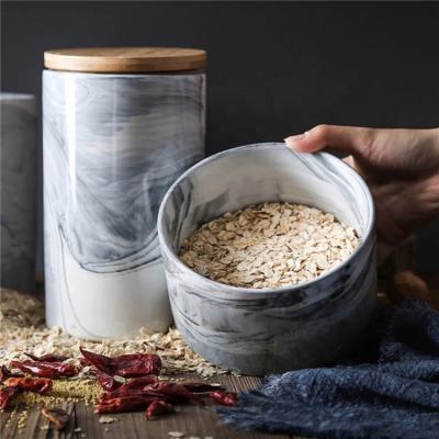 China Cheap wholesale elegant cylinder tea set food storage canister/coffee tea marble ceramic jar with bamboo lid for sale