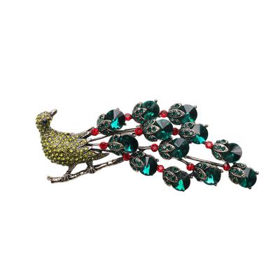 China Fabric Decoration Customized Gold Plated Alloy Peacock Brooch Inlaid Crystal Rhinestone for sale