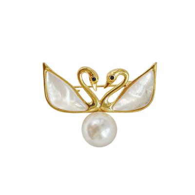 China Customized Stylish Fashion Double Swan Shell Wings Peal Alloy Brooch For Women for sale