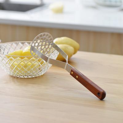 China Sustainable Stainless Steel Kitchen Tool Potato Masher Press Wooden Material Product for sale