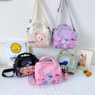 China Kaijie Version Children's Handbag Fashion Cartoon Printing Girl Canvas Portable Cute Princess Bag Korean Daily Used Graffiti Bento Cross Bag for sale