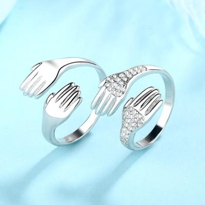 China CLASSIC couples ring men and women palm love embrace ring micro inlaid adjustable zircon ring for gift for sale