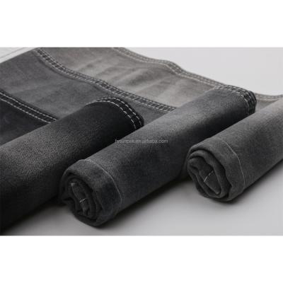 China Cheap Factory Price Shrink-Resistant 9oz Bulk High Poly Cotton Spandex Sulfur Squishy Black Jeans Fabric Raw Material for sale