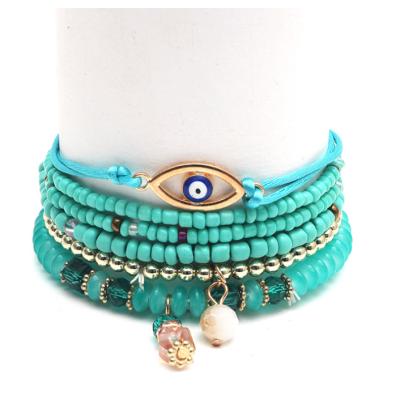 China BOHEMIA Factory Designer Boho Multi Layer Rice Beaded Evil Eye Bracelet Gold Plated For Woman Supplier Customize Bracelet For Handmade for sale