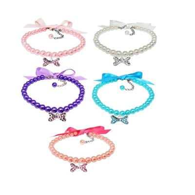 China Luxury JEWELED Bling Bow Ribbon Pet Pearl Necklace Cat Diamond Necklace Small Dog Adjustable With Bone Shape Rhinestones Pendant for sale