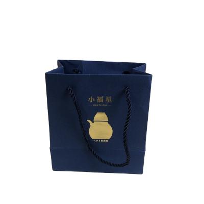 China Custom Logo Folding Shopping Bags Jewelry Eco Friendly Paper Bags With Your Own Logo for sale