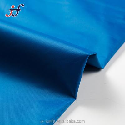 China 100% Polyester Death Tear-Resistant PVC Coated Waterproof 210T Taffeta Fabric For Rain Coat / Tent for sale