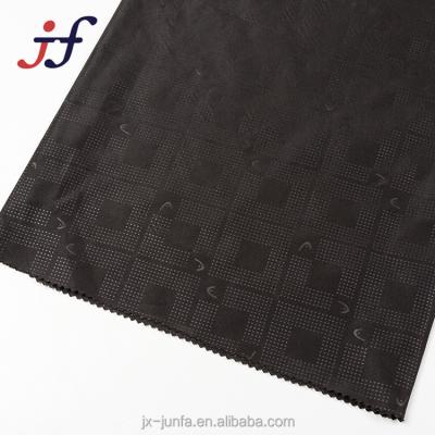 China Anti-static 100% Polyester 210T Embossed Black Pongee Garment Lining Fabric for sale