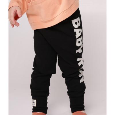 China Black letter boys girls outdoor pants breathable unisex slim fit straight casual sports kids stretch pants boys trousers for sale