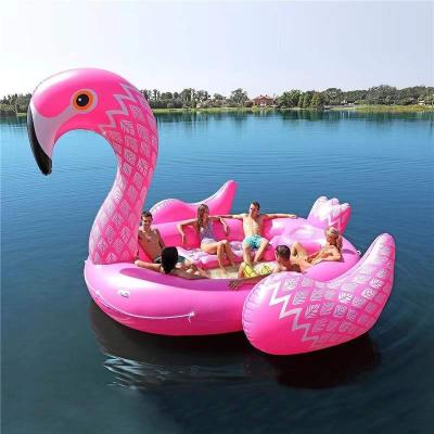 China Pink Hot Sale 6 Person Flamingo River Raft Flamingo Pool Float Inflatable Water Float OBL Shape Flamingo Fun Floating Islands for sale