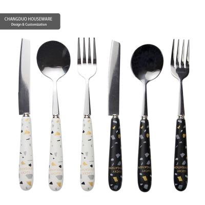 China Ins Style Stocked Creative Spoon Knife Fork Texture Restaurant Hotel Water-milled Table Set Ceramic Stainless Steel Cutlery Handle for sale