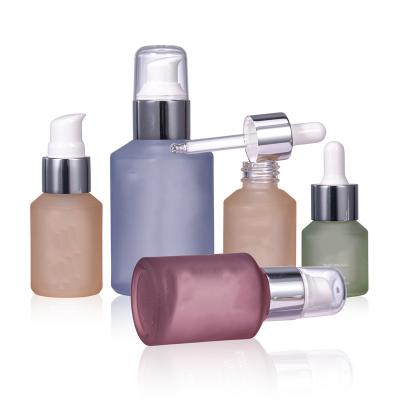 China 15ml 30ml 60ml 100ml Cosmetic Bottle Oblique Face Glass Shoulder Serum Packaging Bottle With Dropper And Pump for sale