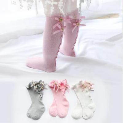 China Spring and Autumn Kid Socks With Bow QUICK DRY Lace Button Baby Socks Cotton Tube Girls Children Long Socks for sale