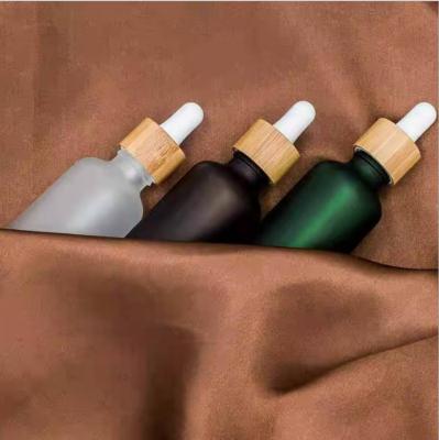 China Recyclable High End Essential Bamboo Ring Rubber Head Glass Cusp Dropper Bottle China Essential Glass Bottle for sale