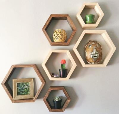 China Indoor Storage Plant Customization Wooden Wall Shelf Living Room Decoration Honeycomb Wall Shelves for sale